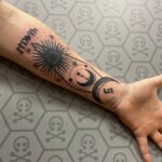 Unterarm Tattoo mit verschiedenen astronomischen Motiven