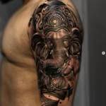 Ganesha Oberarm Tattoo